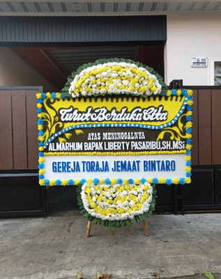 Papan Bunga Duka di Moba